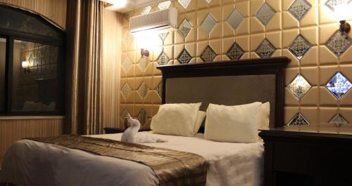 Ein Bett oder Betten in einem Zimmer der Unterkunft Rana Palace