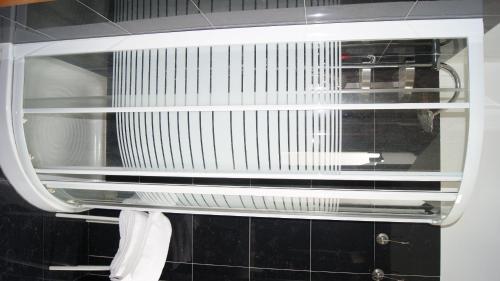 a microwave with its door open in a kitchen at Hotel Ristorante Novara Expo in Bareggio