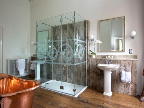 a bathroom with a sink, toilet and bathtub at Bailbrook House Hotel, Bath in Bath