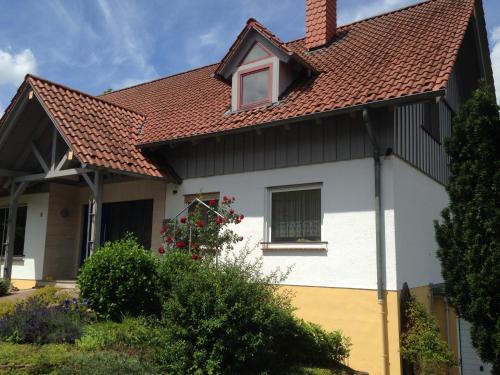 a white house with a red roof at Josefine in Waldkappel