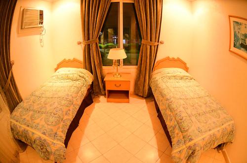 Posteľ alebo postele v izbe v ubytovaní Al Murjan Beach Resort