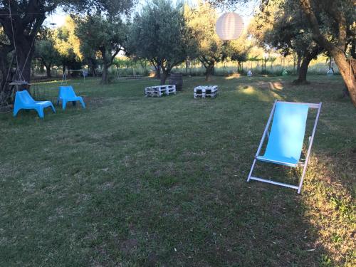 a blue easel sitting on the grass in a park at Ripari di Giobbe in Ortona