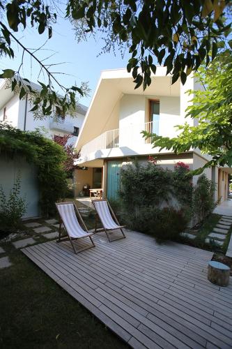 two chairs sitting on a patio in front of a house at 20dimare in Cesenatico