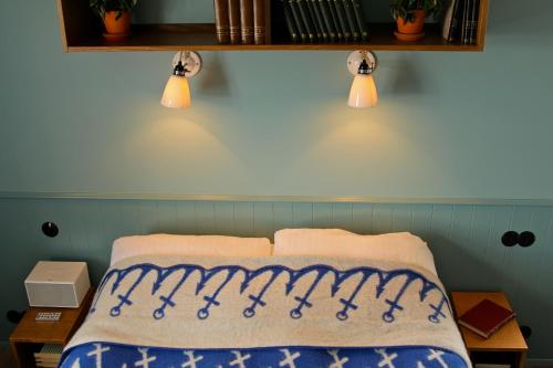 Una cama o camas en una habitación de Hótel Egilsen