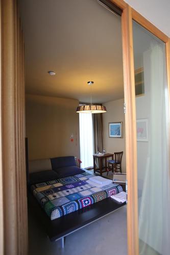 a bedroom with a bed in a room with a window at 20dimare in Cesenatico