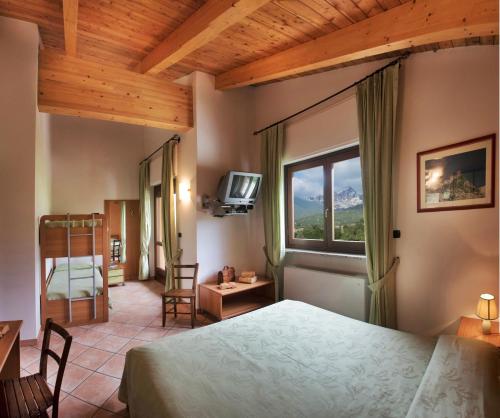 Postel nebo postele na pokoji v ubytování Hotel la Colletta