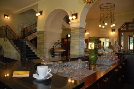 a bar with glasses on a counter in a restaurant at Mattenhof Resort in Interlaken