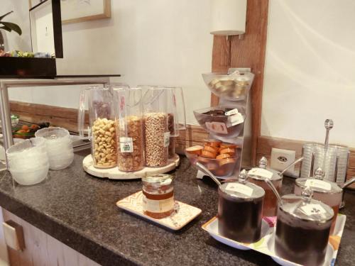 a kitchen counter with a bunch of food on it at Hotel Kernen in Gstaad
