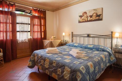 מיטה או מיטות בחדר ב-Il Casolare Di Leonardo