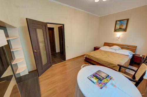 Cama o camas de una habitación en Aleksandria Hotel