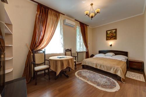 Cama o camas de una habitación en Aleksandria Hotel