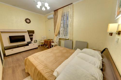 Cama o camas de una habitación en Aleksandria Hotel