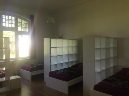 Ένα ή περισσότερα κρεβάτια σε δωμάτιο στο Villa Blumenthal