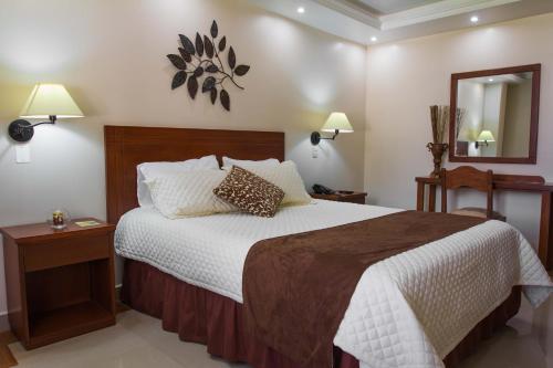 Un pat sau paturi într-o cameră la El Cano