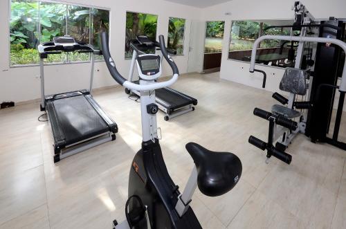 a gym with several tread machines and a treadmill at SJ Tour - San Juan Foz do Iguaçu in Foz do Iguaçu