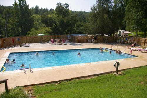 a group of people in a swimming pool at Green Mountain Park in Lenoir