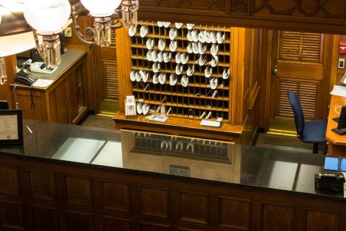 a kitchen with a counter with a lot of cups at Missouri Athletic Club in Saint Louis