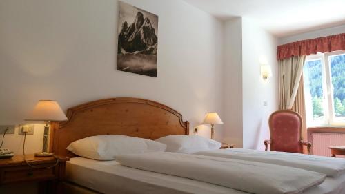Postel nebo postele na pokoji v ubytování Hotel Waldheim