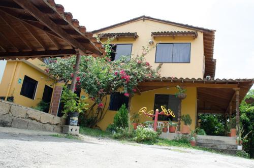 a house that has a patio with a view of the ocean at Hospedaje la Glorieta in Santa Fe de Antioquia