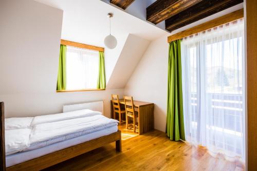 Postel nebo postele na pokoji v ubytování Penzion U Barana