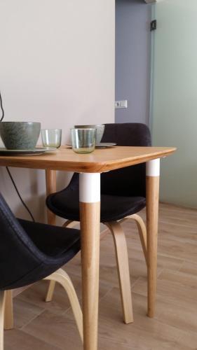 a wooden table with two bowls on top of it at Lagarfell Studios in Egilsstadir