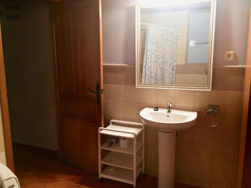 a bathroom with a sink and a mirror at Casa Marcial in Chía