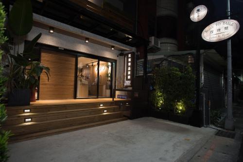 a front door of a store at night at Royal Rose Hotel Shuangcheng Hall in Taipei