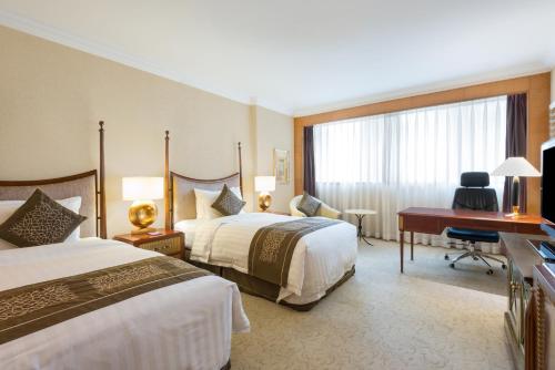 Postel nebo postele na pokoji v ubytování Crowne Plaza Qingdao by IHG