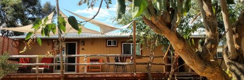 a house with a tent in front of it at Vinofilia Wine Country Inn in Valle de Guadalupe