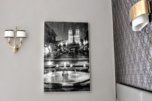 a picture hanging on a wall in a room at Navona Residenza de Charme in Rome