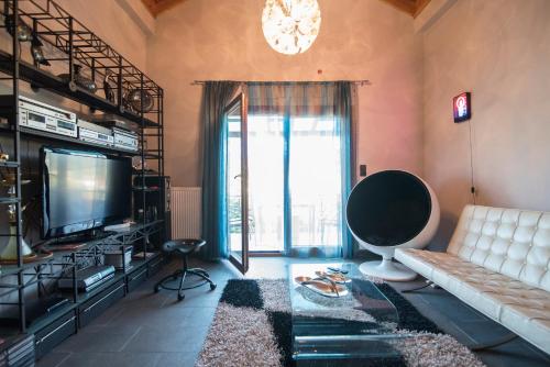 Odysseos St. Loftにあるテレビまたはエンターテインメントセンター