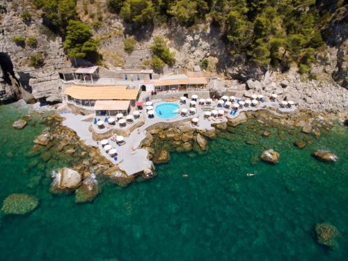 an aerial view of a resort in the water at Grand Hotel Tritone in Praiano