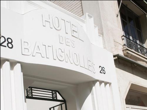 a building with a sign that reads hotel des bathrooms at Hôtel des Batignolles in Paris