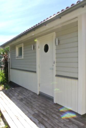 a garage with a white door at Room by Water in Södertälje