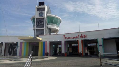 a building with a clock tower on top of it at Lumut Valley Resort Condominium in Lumut