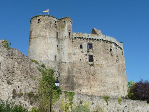 a castle with a flag on top of it at maison La Marche in Cugand