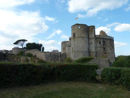 an old castle with a flag on top of it at maison La Marche in Cugand