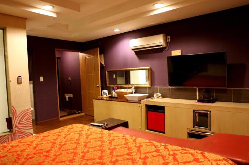 Kuchyň nebo kuchyňský kout v ubytování V Motel Songdo