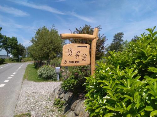 a sign that is on the side of a road at Bed and Breakfast Hasseloe in Nykøbing Falster