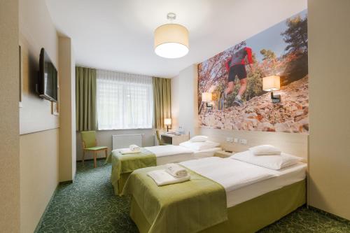 מיטה או מיטות בחדר ב-Interferie Sport Hotel Bornit