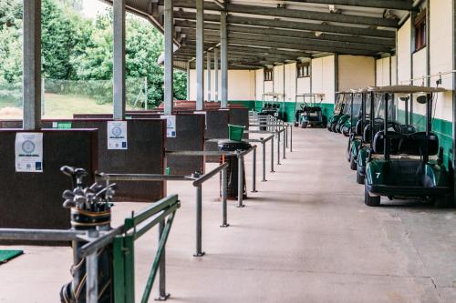 a train station with rows of cars parked in it at Draycote Hotel And Whitefields Golf Course in Rugby