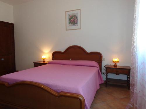 Un pat sau paturi într-o cameră la Podere Poggio San Vito