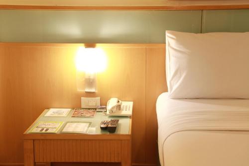 Katil atau katil-katil dalam bilik di Ten Stars Hotel