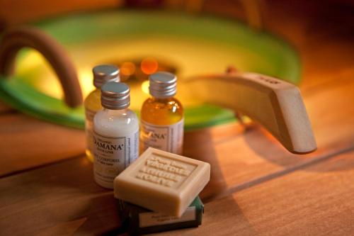 a counter with two bottles of medicine and a faucet at Hotell Heden - BW Signature Collection in Gothenburg