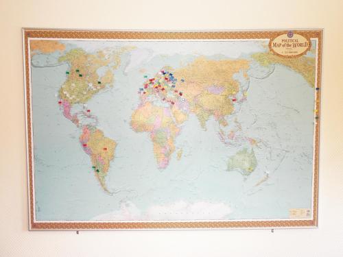 a map of the world pinned to a wall at Apartment on Nimanska 5 in Kyiv