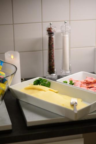 a plate of food on a table with a fork at Alkoven Logi in Ullared