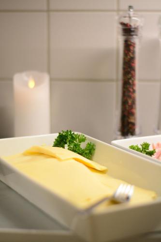 a plate of food on a counter with a fork at Alkoven Logi in Ullared