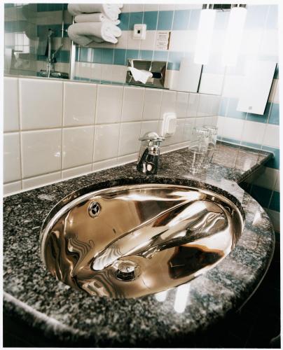 a sink in a bathroom with a counter top at Hotell Heden - BW Signature Collection in Gothenburg
