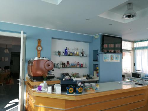 a kitchen with blue walls and a counter top at Rock Garden in Gaeta