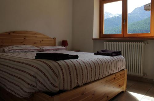 מיטה או מיטות בחדר ב-B&B Villa Dalegno